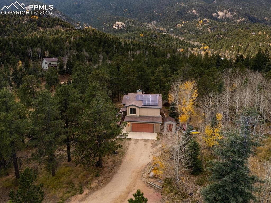 320 Hilton Road Manitou Springs, CO 80829 - Photo 4 of 44 an aerial view of a house with a yard and lake view