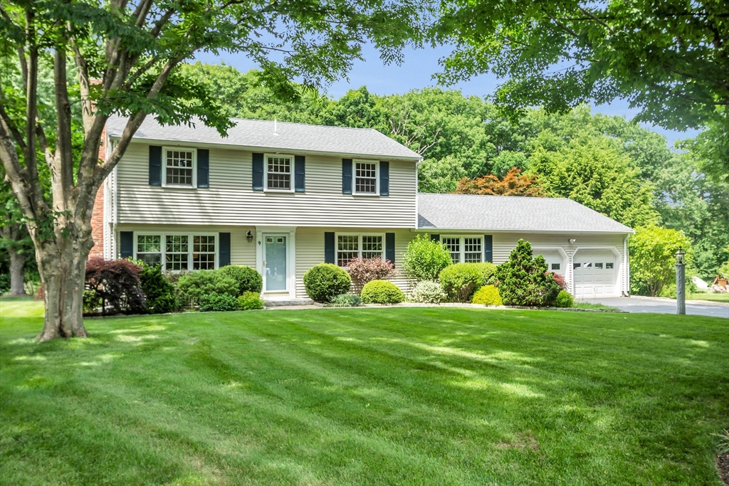 9 Berry Lane Acton, MA 01720 - Photo 1 of 42 a front view of a house with a yard