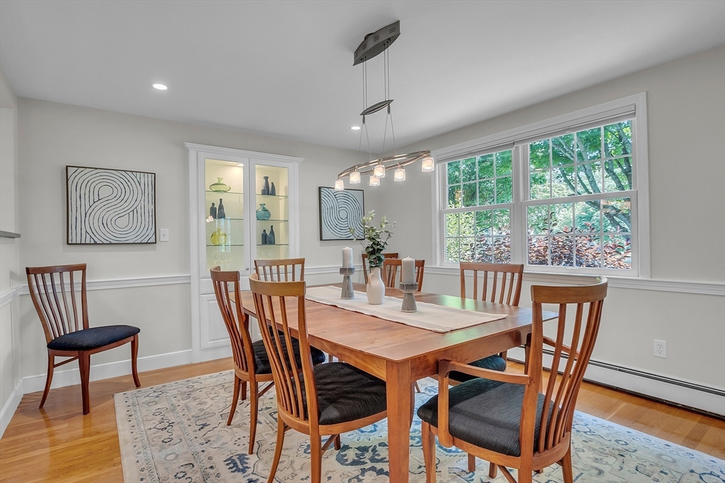 9 Berry Lane Acton, MA 01720 - Photo 12 of 42 a view of a dining room with furniture window and wooden floor