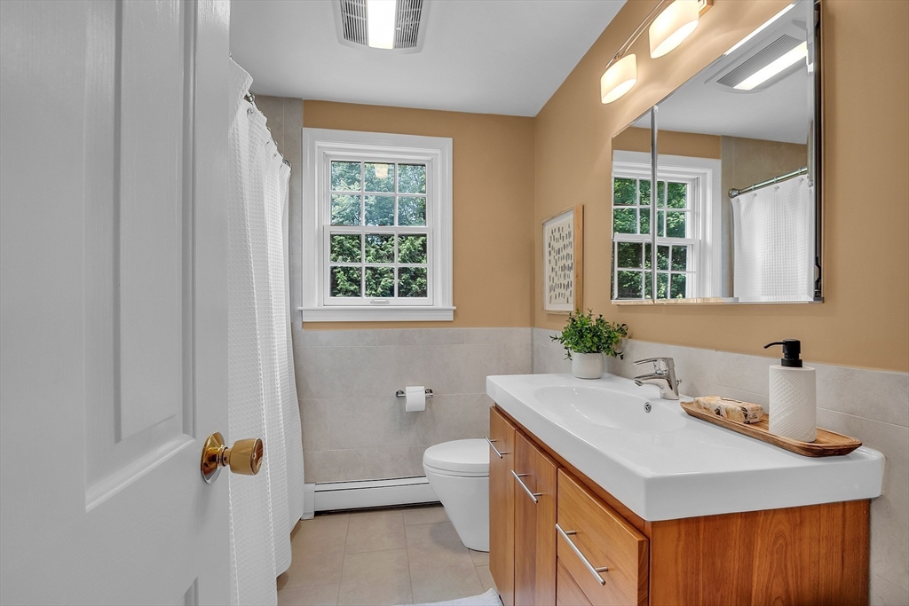 9 Berry Lane Acton, MA 01720 - Photo 30 of 42 a bathroom with a sink toilet and mirror
