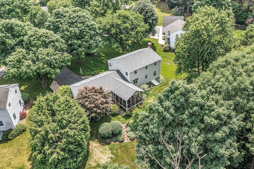 9 Berry Lane Acton, MA 01720 - Photo 3 of 42 an aerial view of a house with a yard and trees