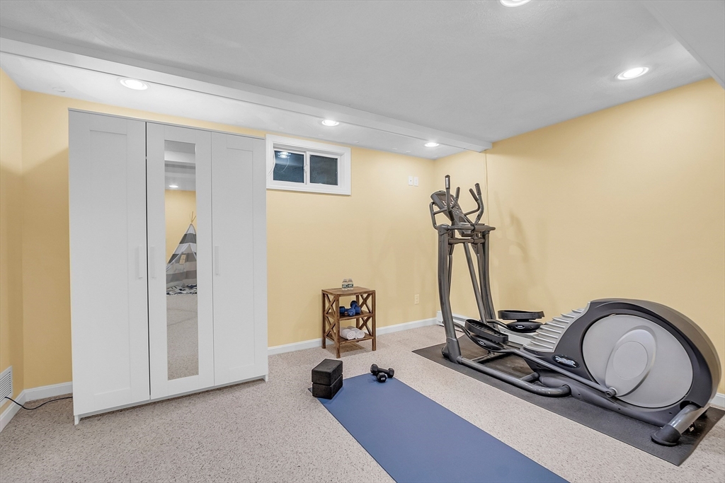 9 Berry Lane Acton, MA 01720 - Photo 34 of 42 a view of a room with gym equipment