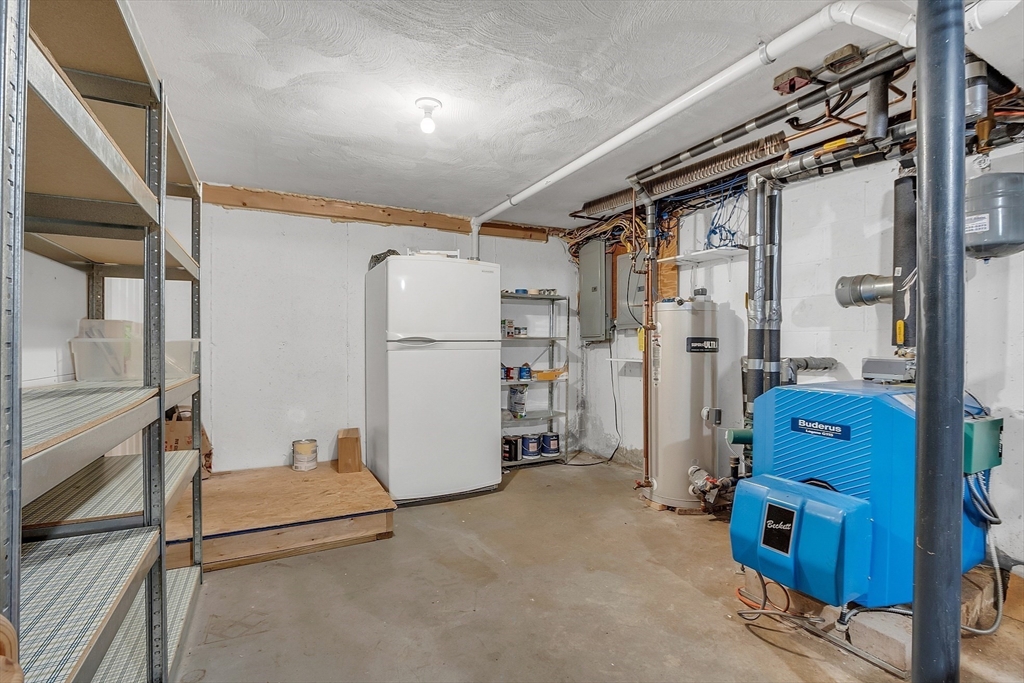 9 Berry Lane Acton, MA 01720 - Photo 35 of 42 a view of a storage & utility room with refrigerator