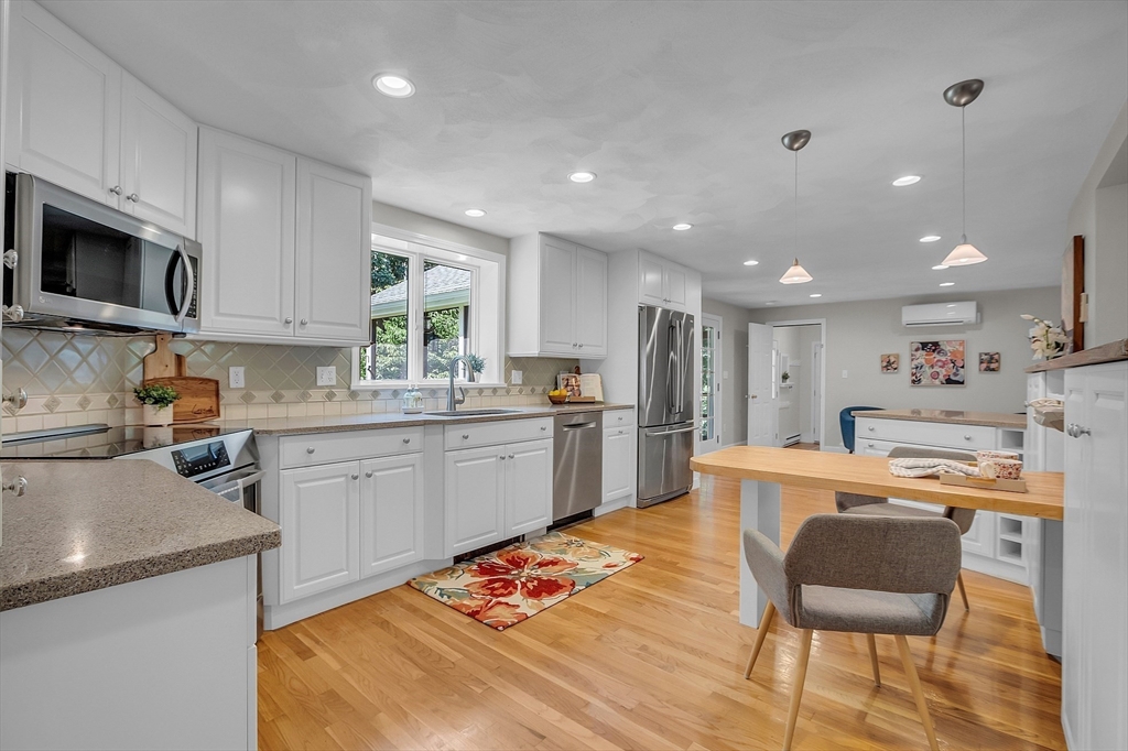 9 Berry Lane Acton, MA 01720 - Photo 4 of 42 a kitchen with stainless steel appliances kitchen island granite countertop a sink and a stove