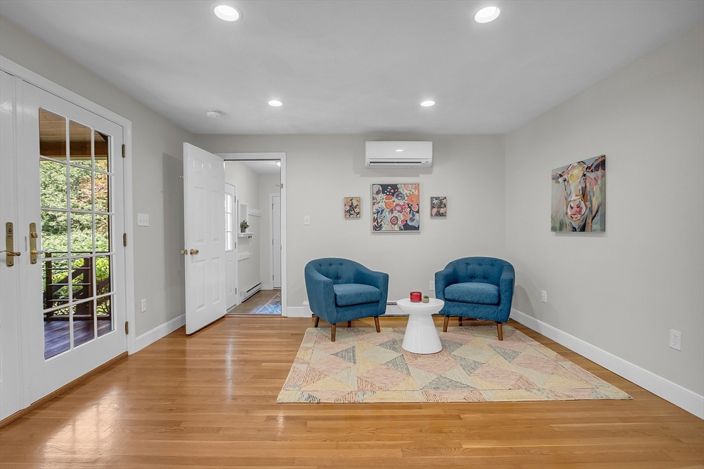 9 Berry Lane Acton, MA 01720 - Photo 9 of 42 a living room with furniture and a rug