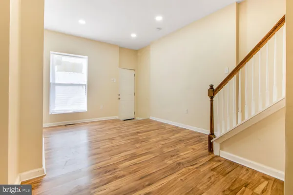 a kitchen with stainless steel appliances granite countertop a sink refrigerator and microwave
