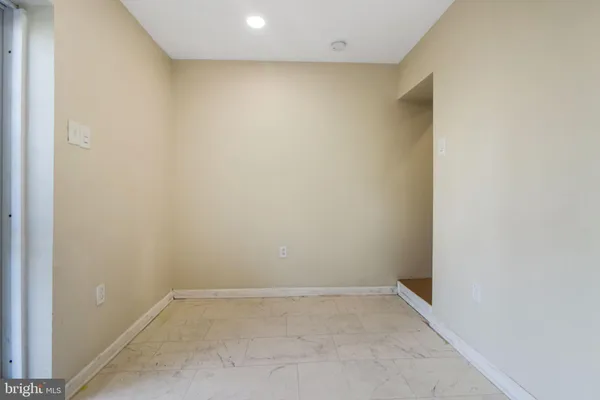 a bathroom with a sink a mirror and a toilet