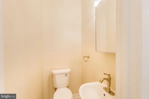 a kitchen with stainless steel appliances wooden cabinets and a sink