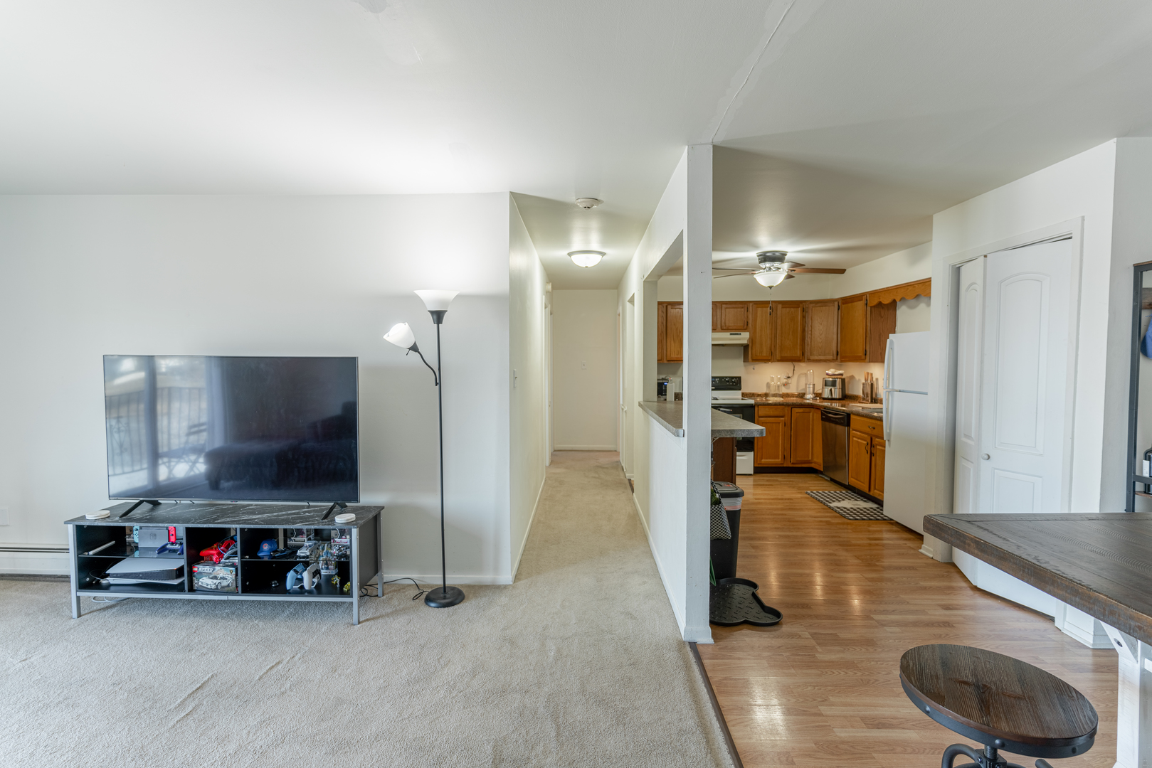 159 West Elk Trail, Unit 357 Carol Stream, IL 60188 - Photo 5 of 10 a living room with furniture and a flat screen tv