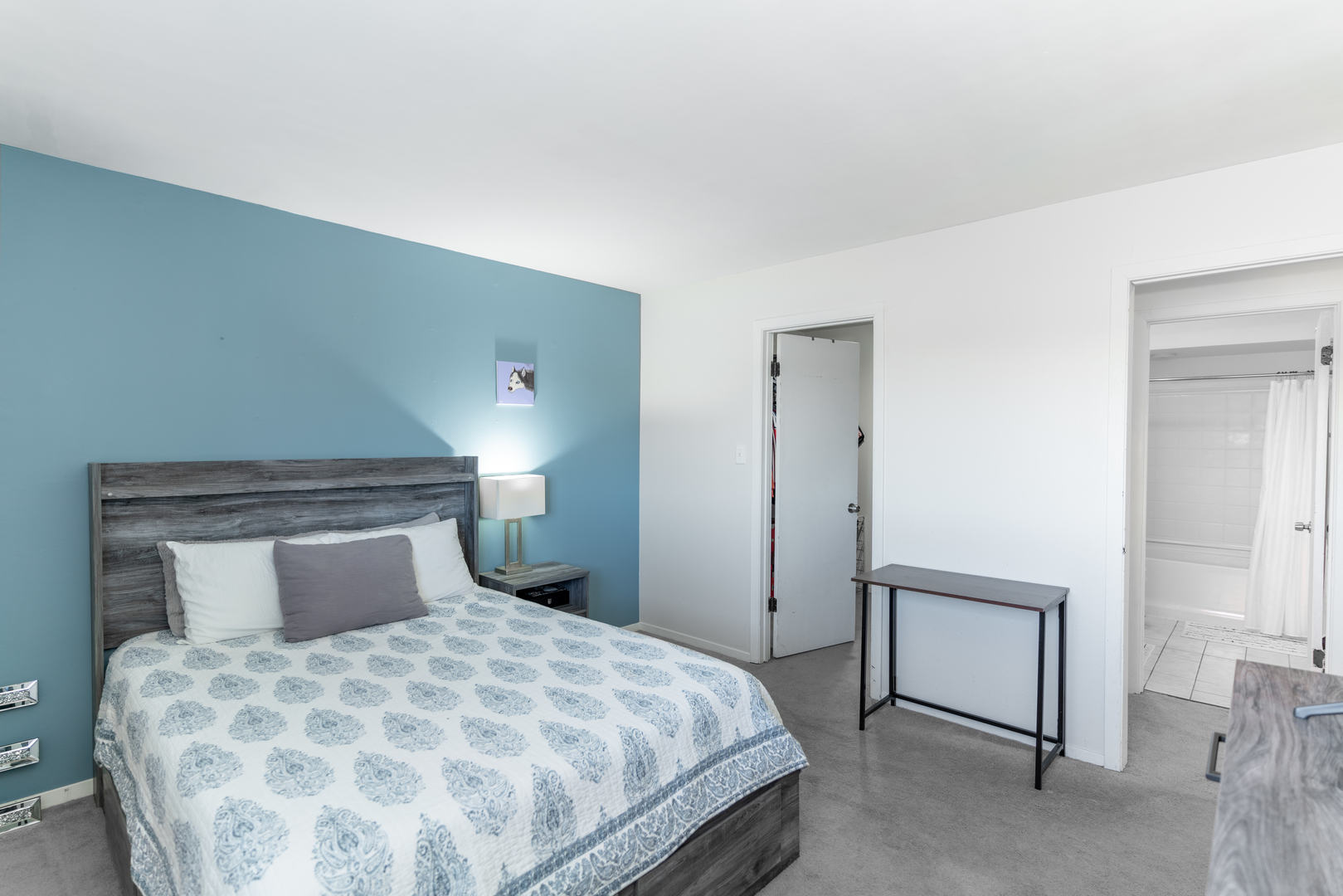 159 West Elk Trail, Unit 357 Carol Stream, IL 60188 - Photo 7 of 10 a bedroom with a bed and a night stand