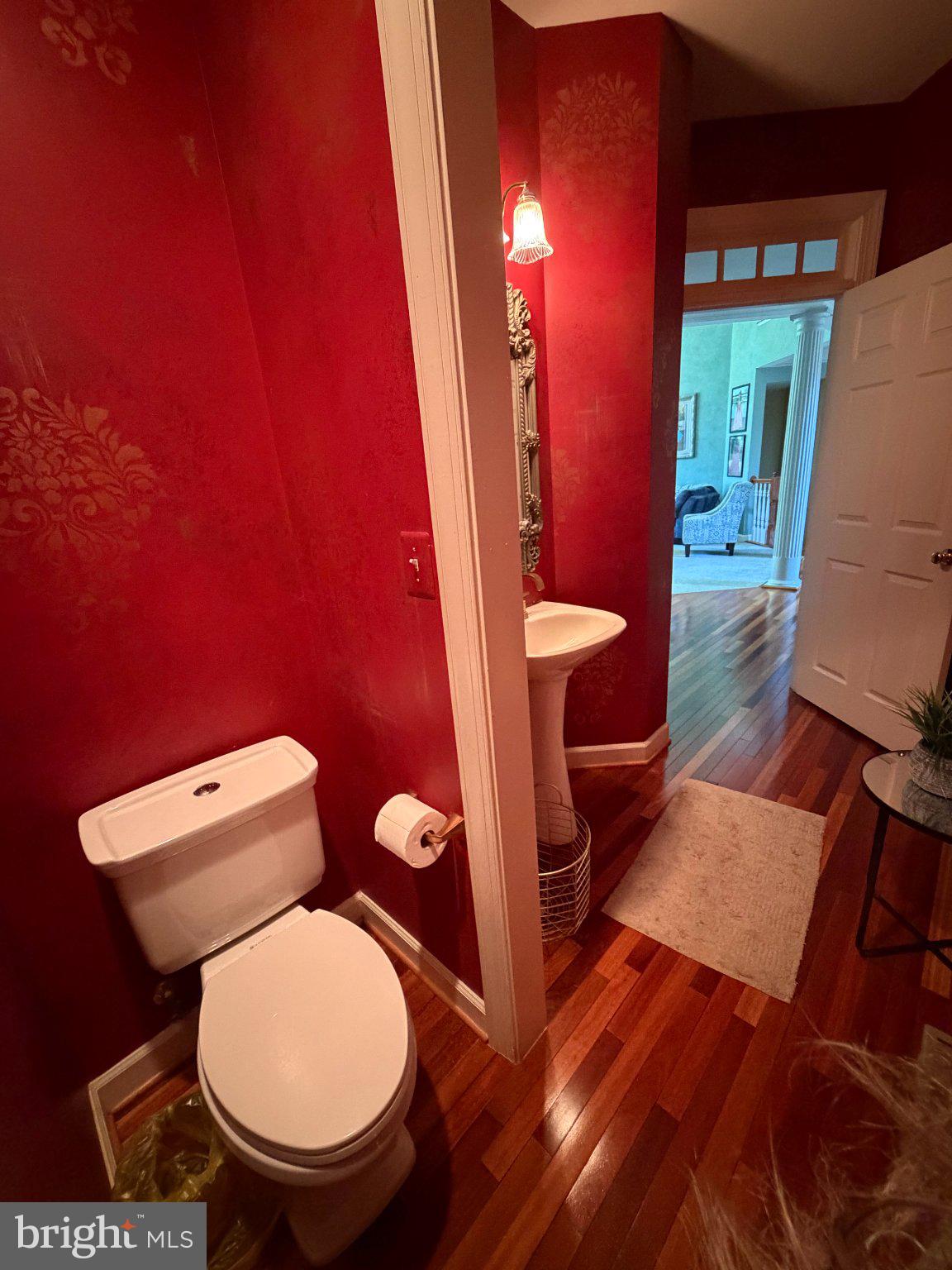 18724 Brooke Road Brinklow, MD 20862 - Photo 14 of 52 Charming half-bath with bold red walls.