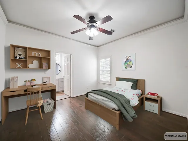 a bedroom with a workspace