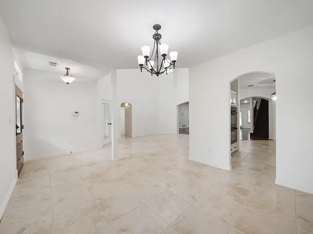 a view of a livingroom with a kitchen