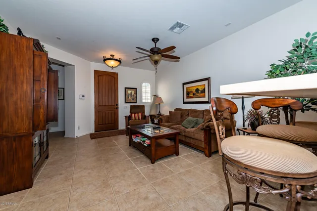 a open kitchen with stainless steel appliances granite countertop a refrigerator a sink a stove and a dining table with the view