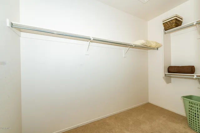 a bathroom with a sink a mirror and vanity