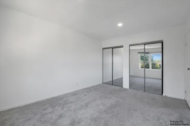 an empty room with an empty space and wooden floor