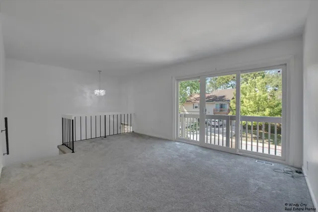 a view of an empty room with a balcony