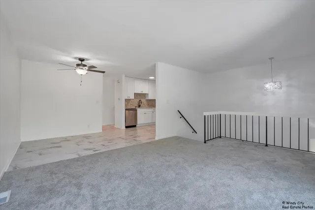 a view of a livingroom with a staircase