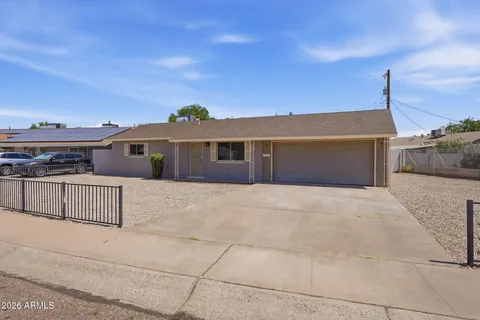 a front view of a house with a garage