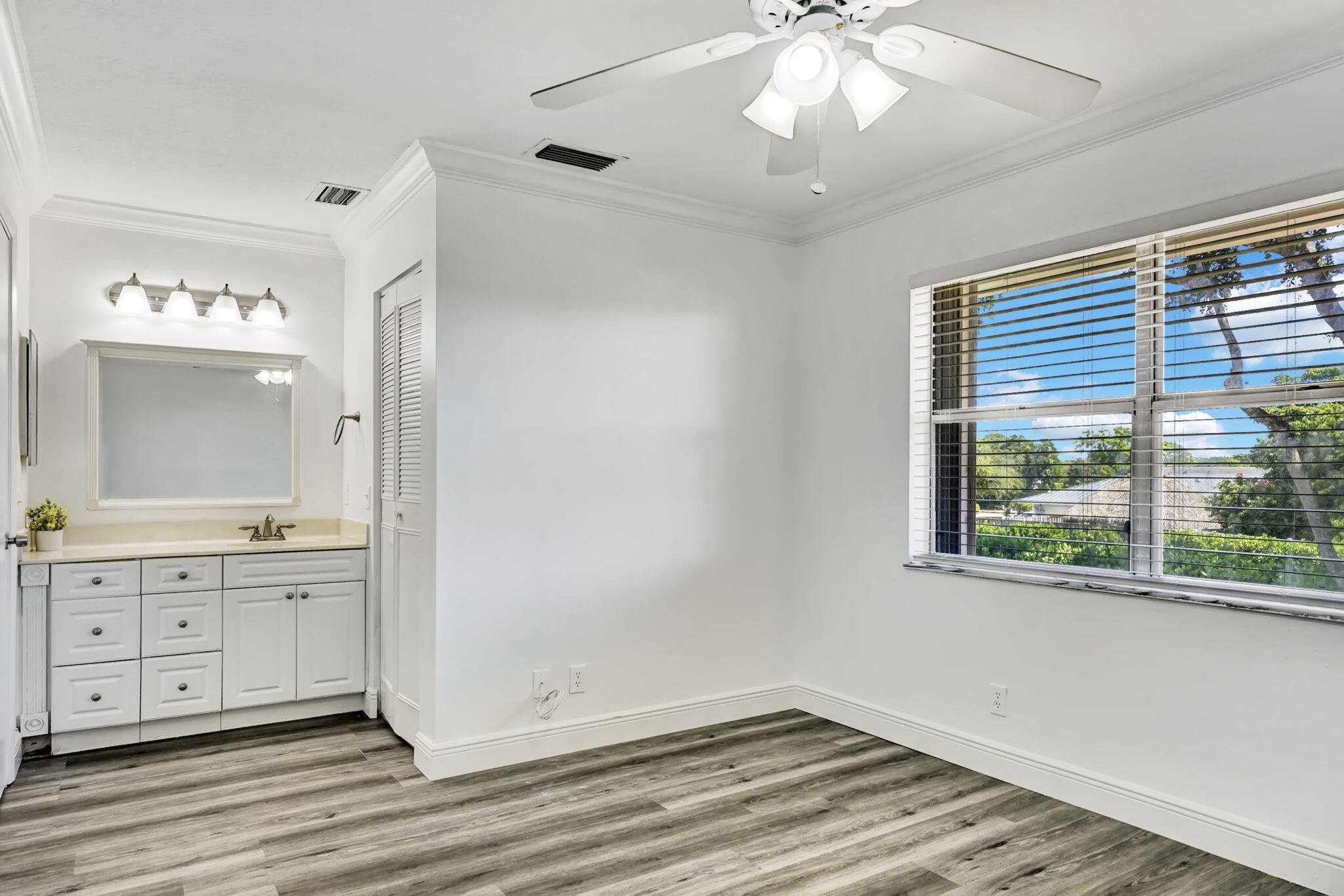 6372 Boca Circle Boca Raton, FL 33433 - Photo 18 of 34 a view of a livingroom with a window and wooden floor
