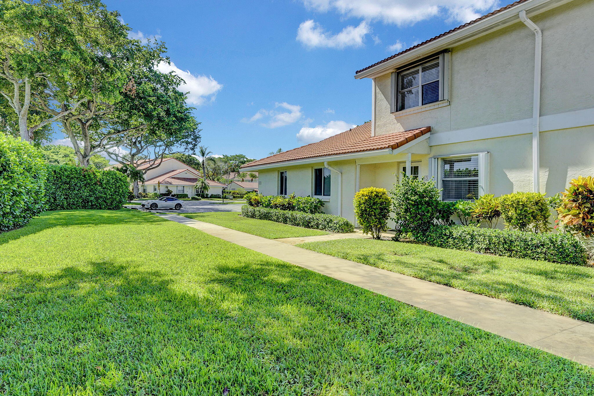 6372 Boca Circle Boca Raton, FL 33433 - Photo 30 of 34 a house view with swimming pool and garden