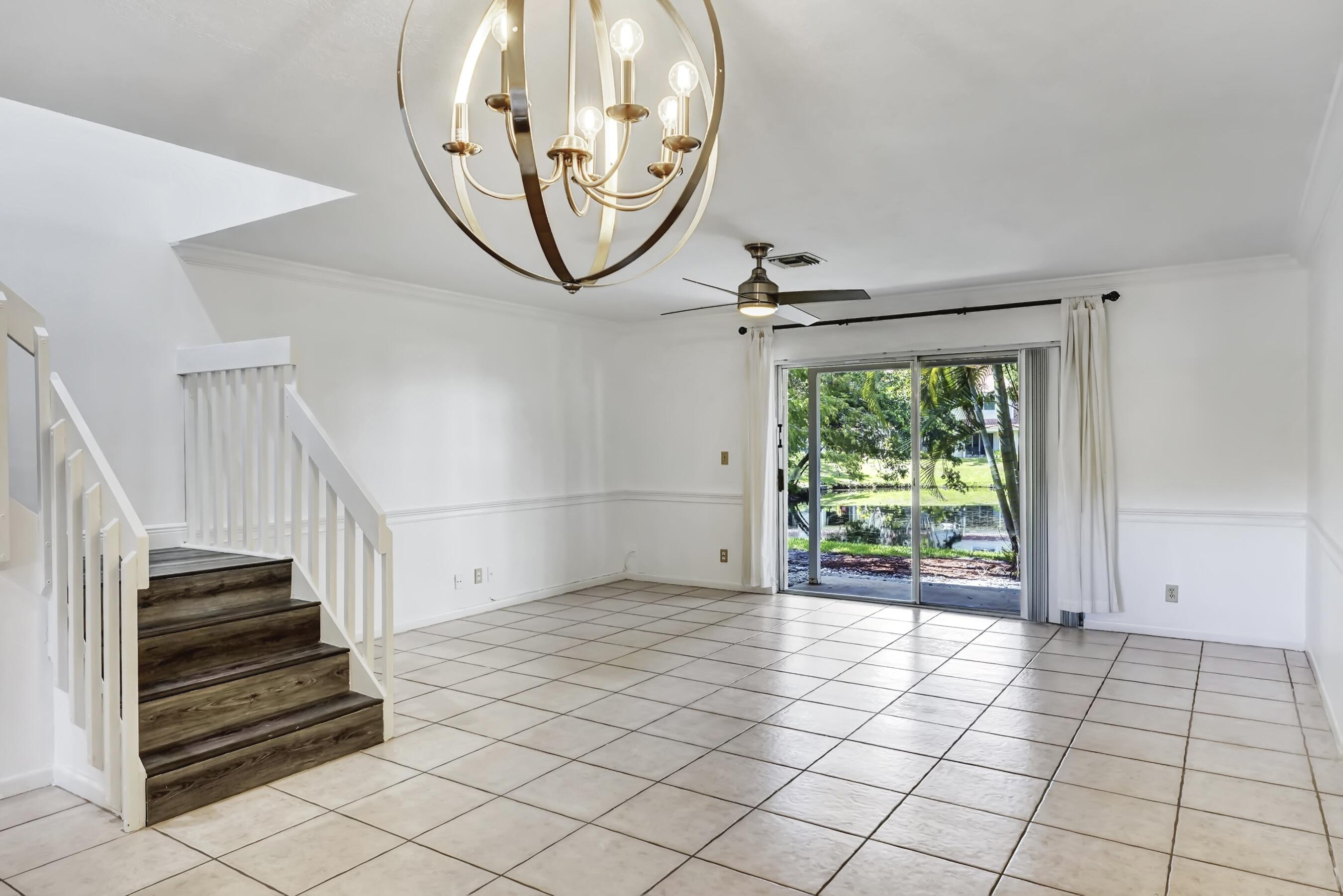 6372 Boca Circle Boca Raton, FL 33433 - Photo 5 of 34 a view of a livingroom with wooden floor and a large window