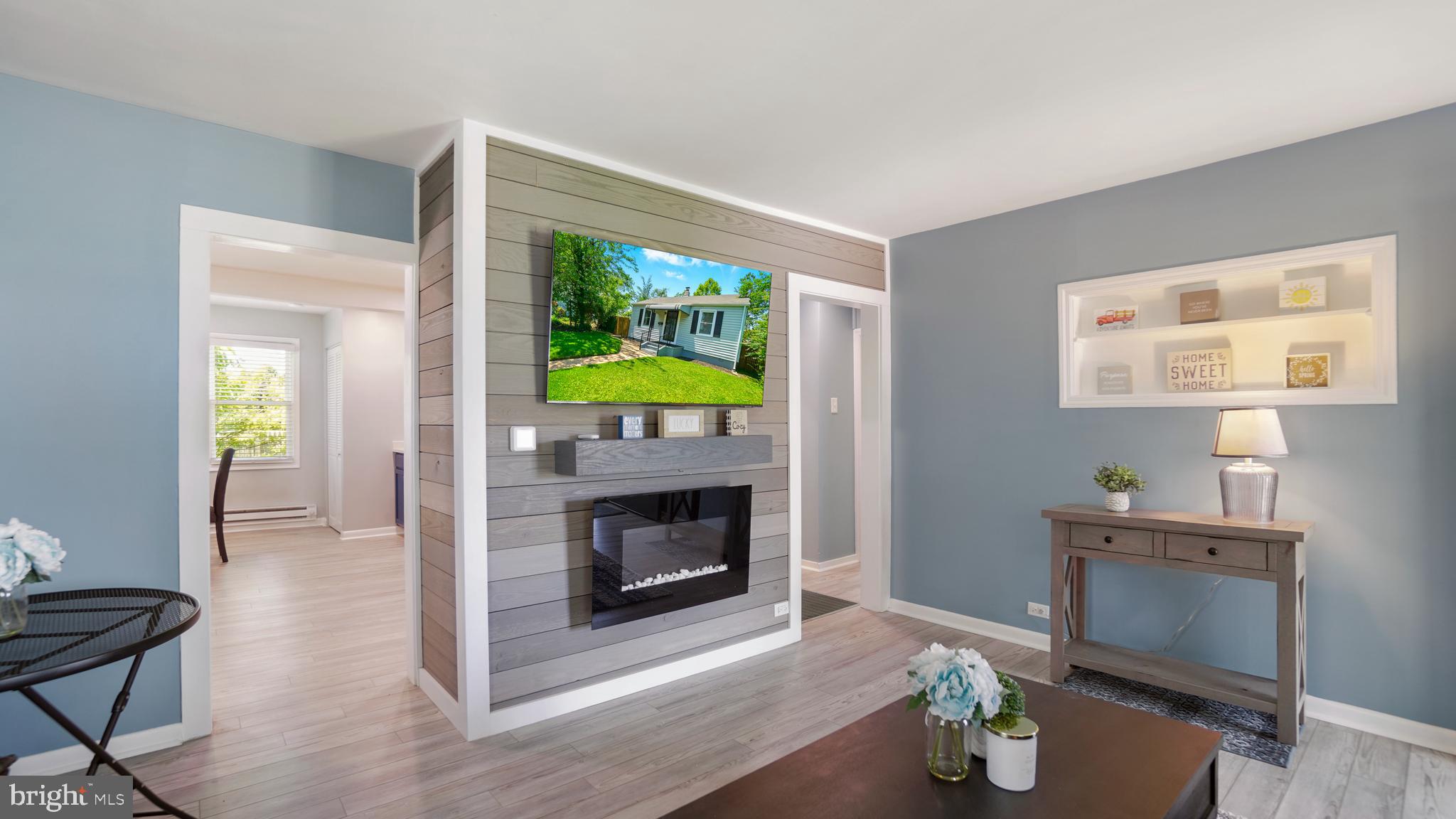 1802 Kitty Hawk Road Baltimore, MD 21221 - Photo 5 of 22 a living room with furniture and a fireplace