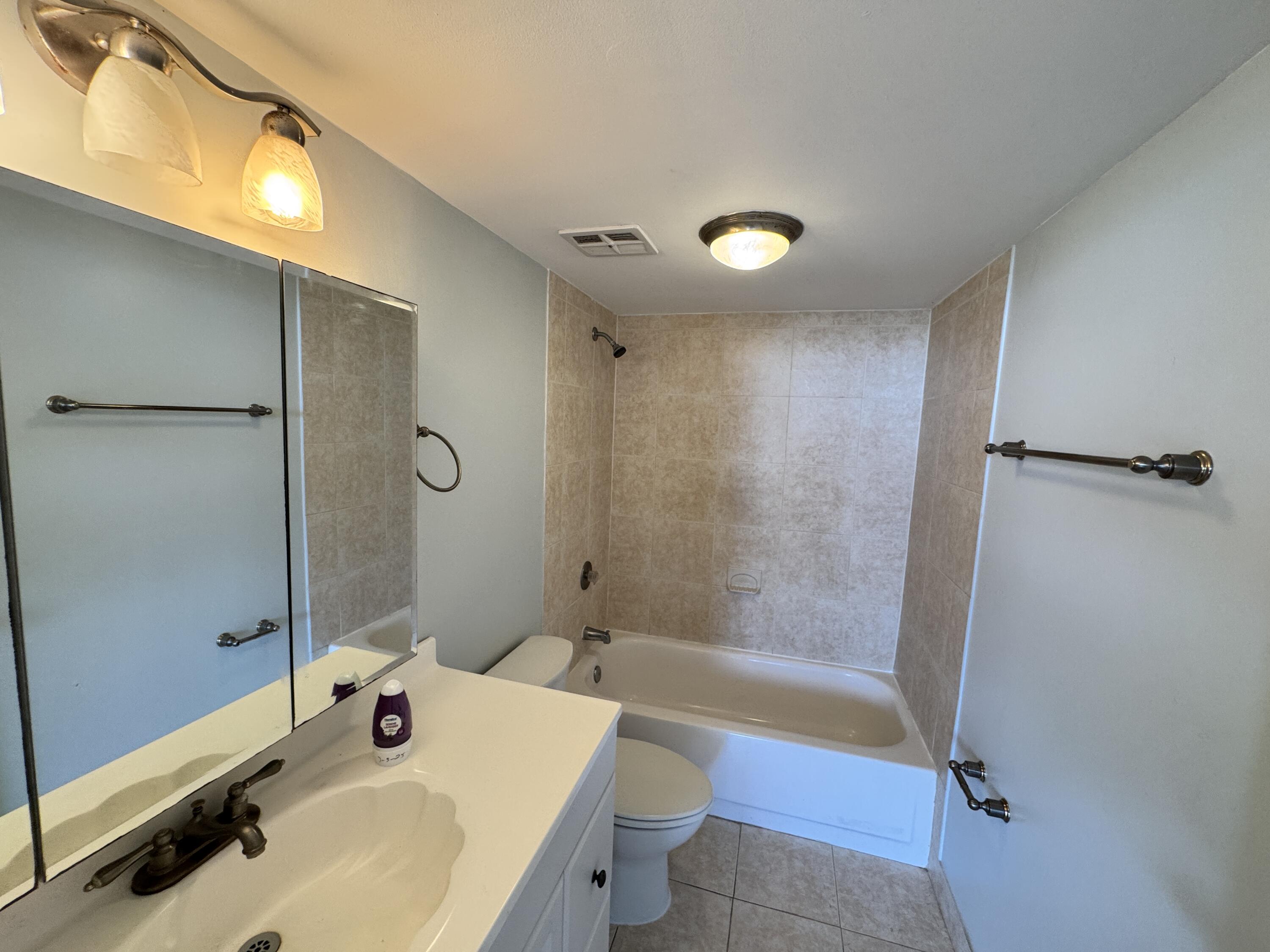 5600 North Flagler Drive, Unit 906 West Palm Beach, FL 33407 - Photo 15 of 18 a bathroom with a sink toilet tub and shower