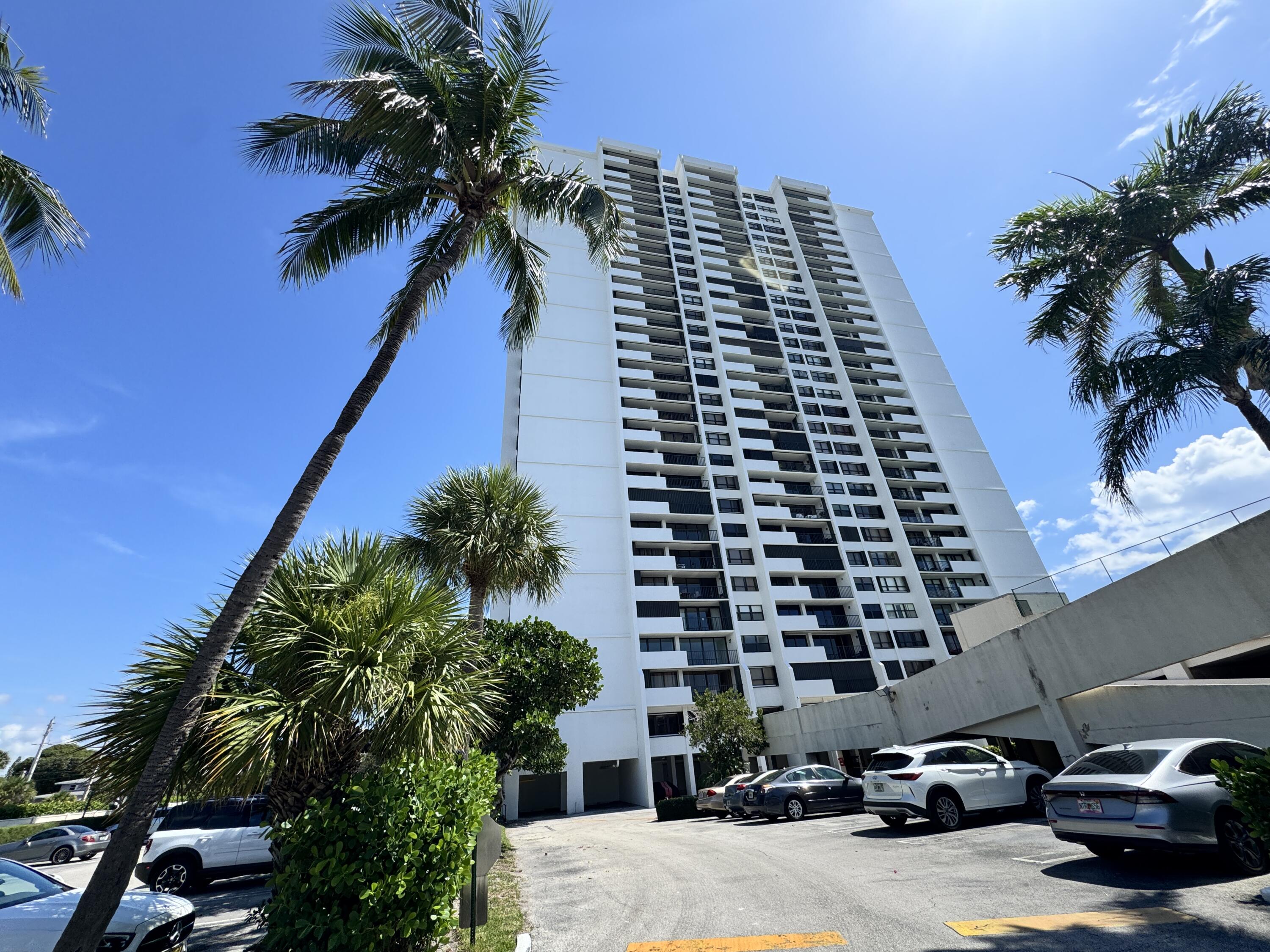 5600 North Flagler Drive, Unit 906 West Palm Beach, FL 33407 - Photo 2 of 18 front view of a building with a street