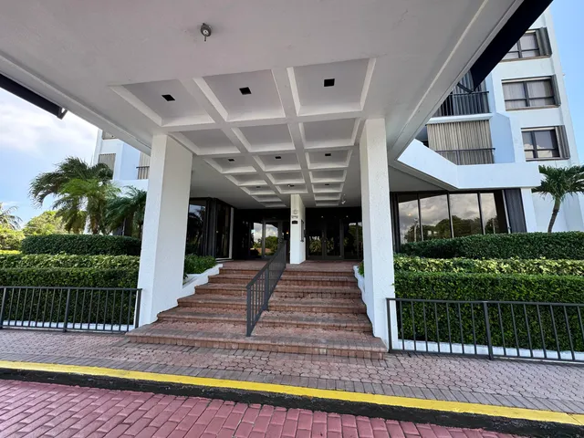 a view of a swimming pool with outdoor seating