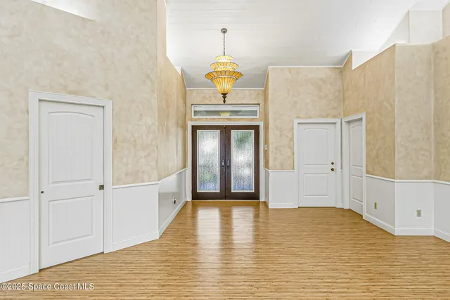 an aerial view of a houses with yard