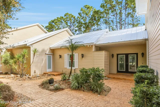 a spacious bathroom with a granite countertop sink a large mirror and a bathtub