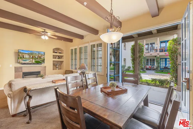 a view of a dining room with furniture wooden floor and chandelier