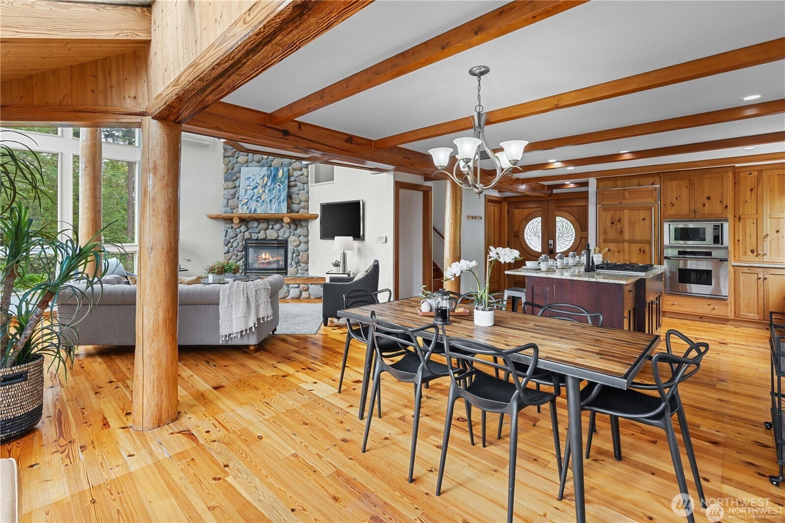 8526 East Mercer Way Mercer Island, WA 98040 - Photo 12 of 40 a view of a dining room with furniture window and wooden floor