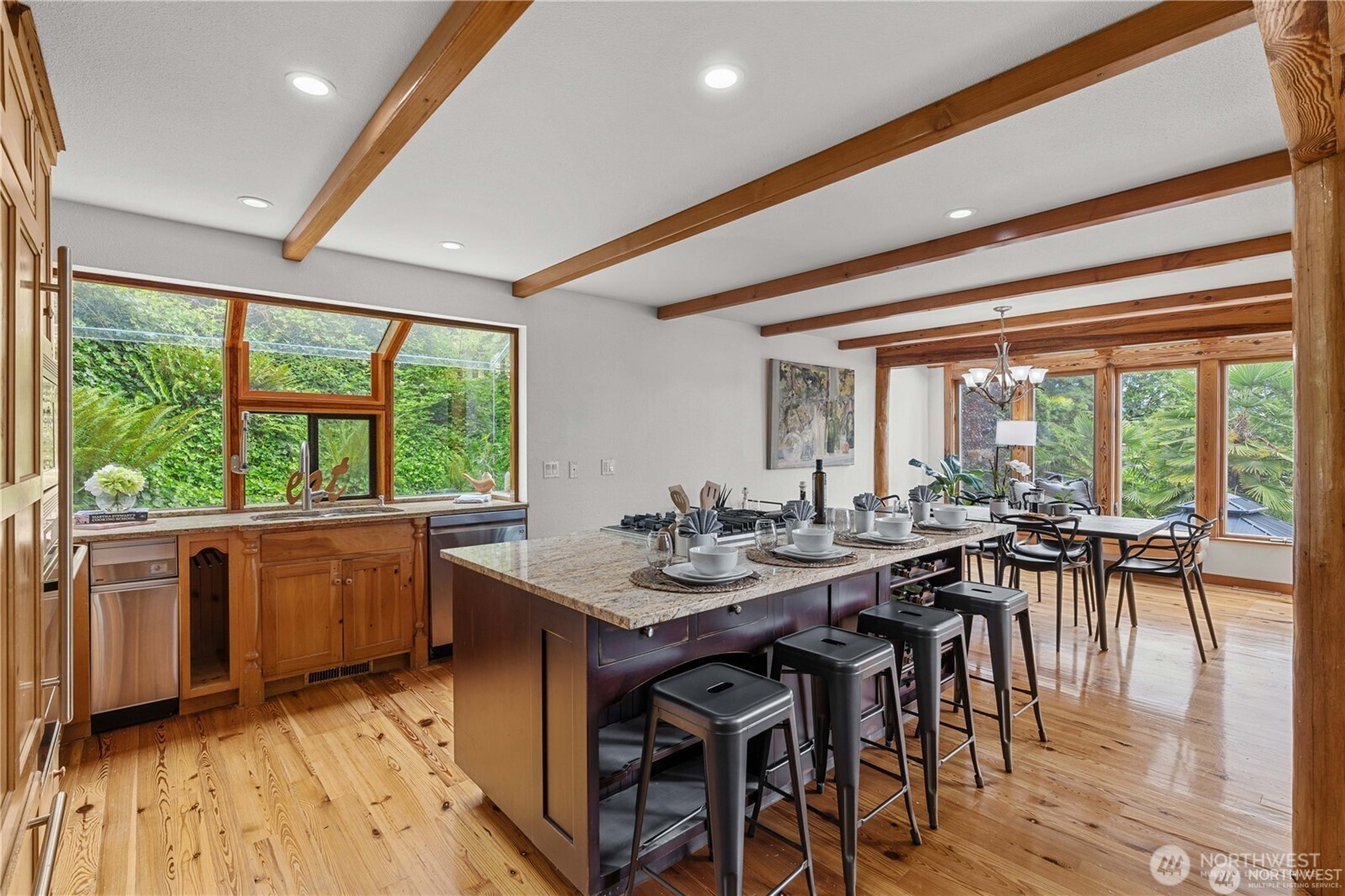 8526 East Mercer Way Mercer Island, WA 98040 - Photo 14 of 40 a view of a dining room with furniture window and outside view