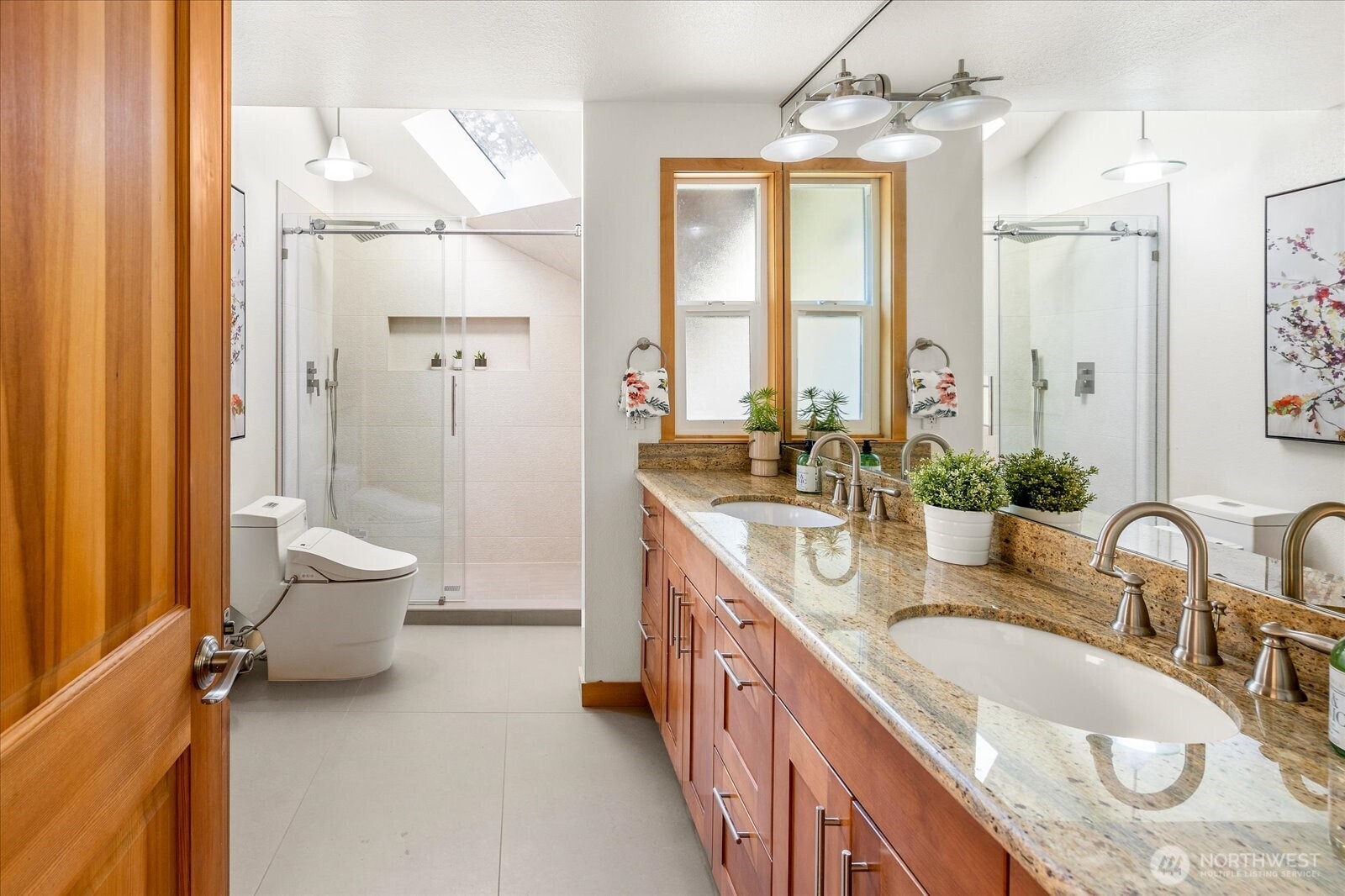8526 East Mercer Way Mercer Island, WA 98040 - Photo 23 of 40 a bathroom with a granite countertop sink toilet and shower