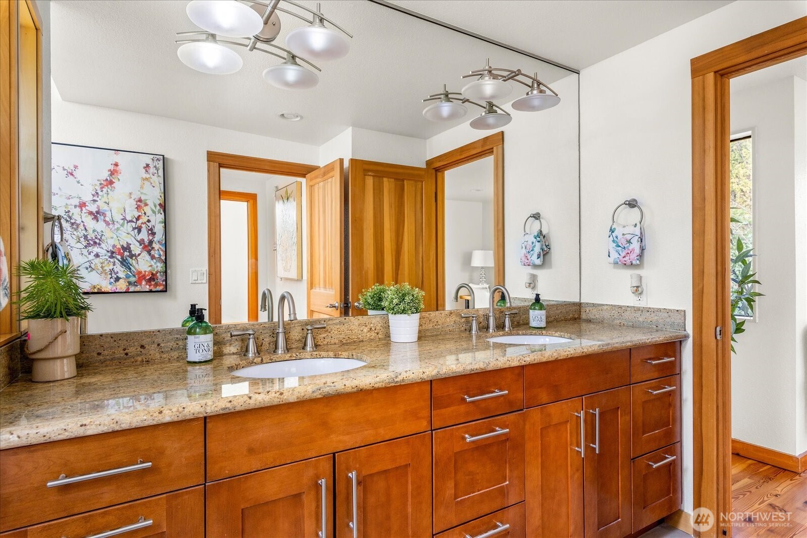 8526 East Mercer Way Mercer Island, WA 98040 - Photo 24 of 40 a bathroom with double vanity and a mirror