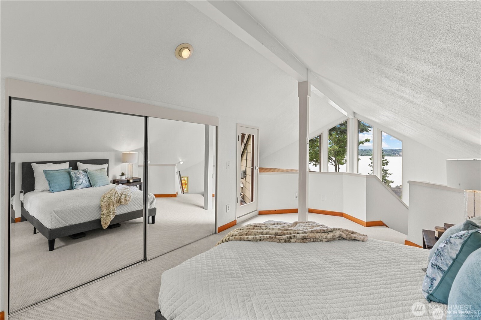 8526 East Mercer Way Mercer Island, WA 98040 - Photo 27 of 40 a bed room with a bed and with chair