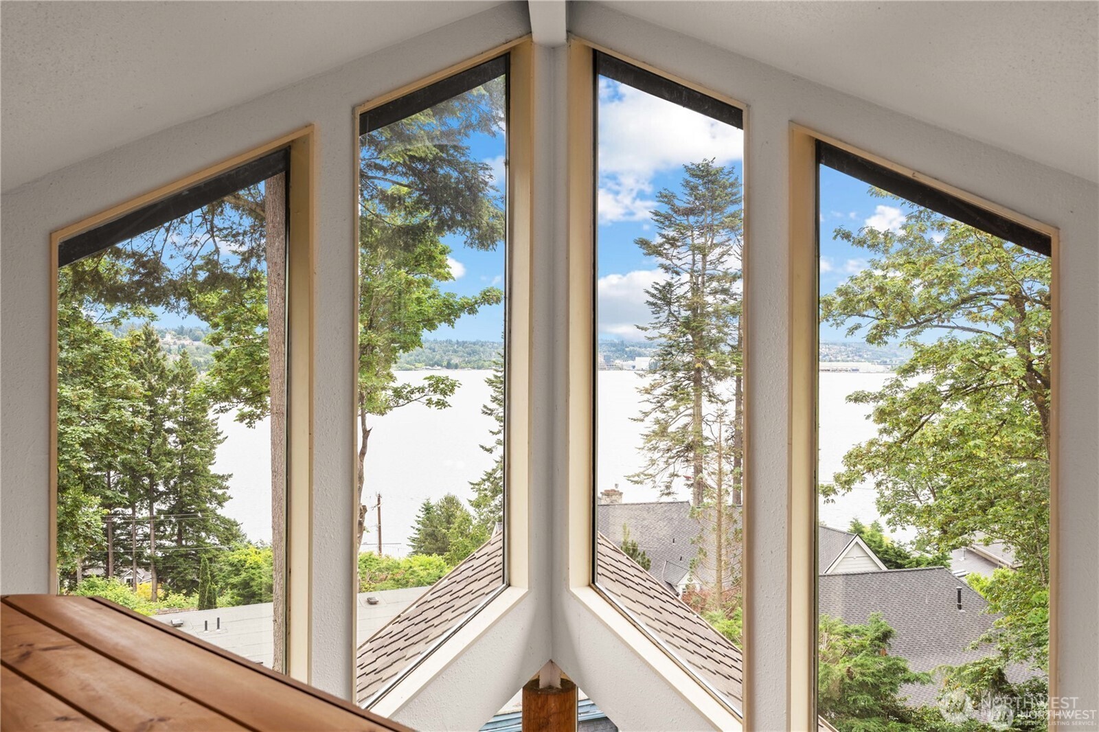 8526 East Mercer Way Mercer Island, WA 98040 - Photo 28 of 40 a view of a room with a large window and wooden floor