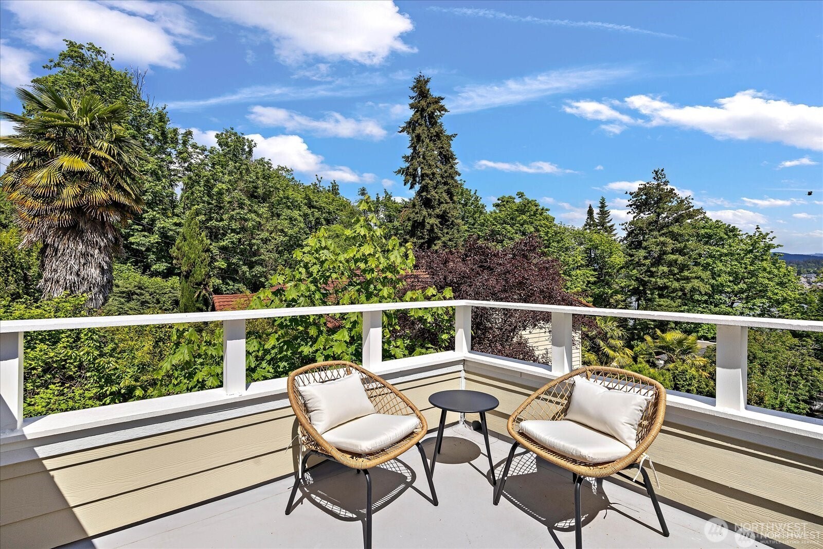8526 East Mercer Way Mercer Island, WA 98040 - Photo 30 of 40 a view of a chair and table in the balcony
