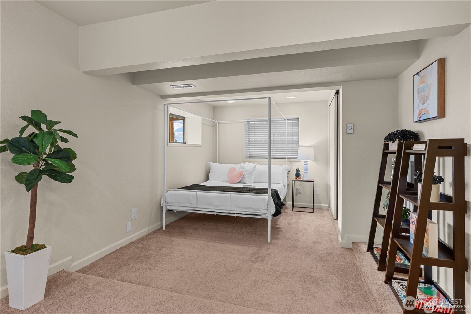 8526 East Mercer Way Mercer Island, WA 98040 - Photo 31 of 40 a bedroom with furniture and a potted plant