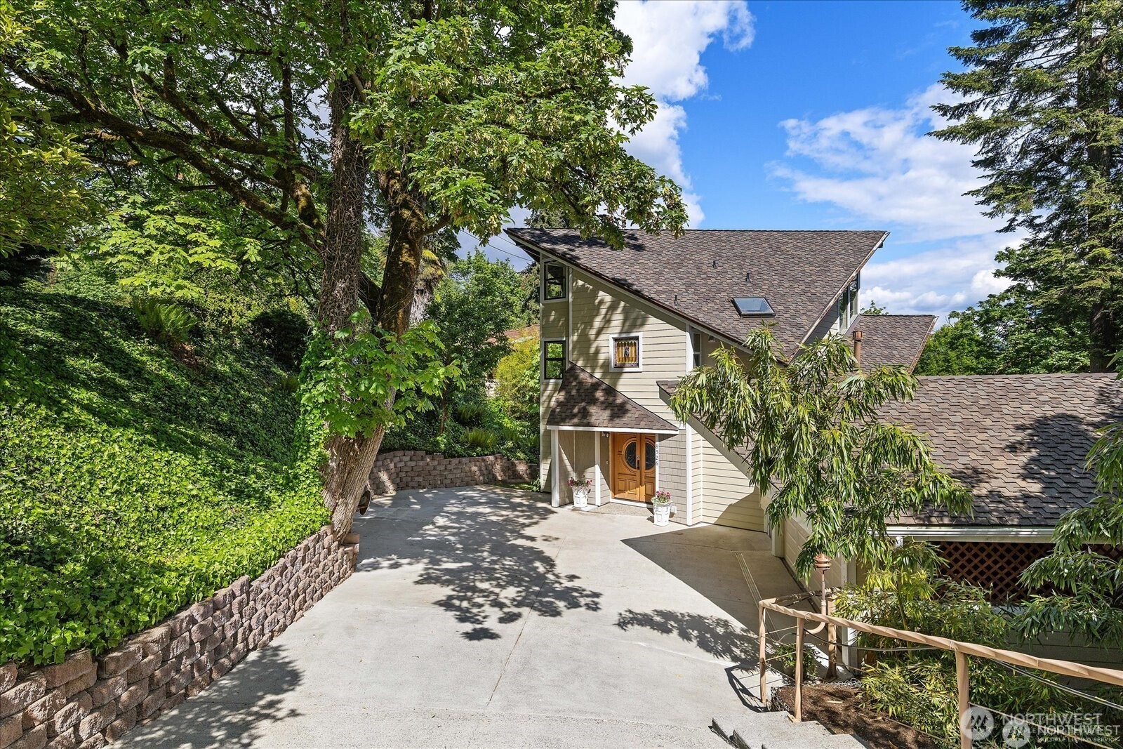 8526 East Mercer Way Mercer Island, WA 98040 - Photo 5 of 40 a aerial view of a house with a yard