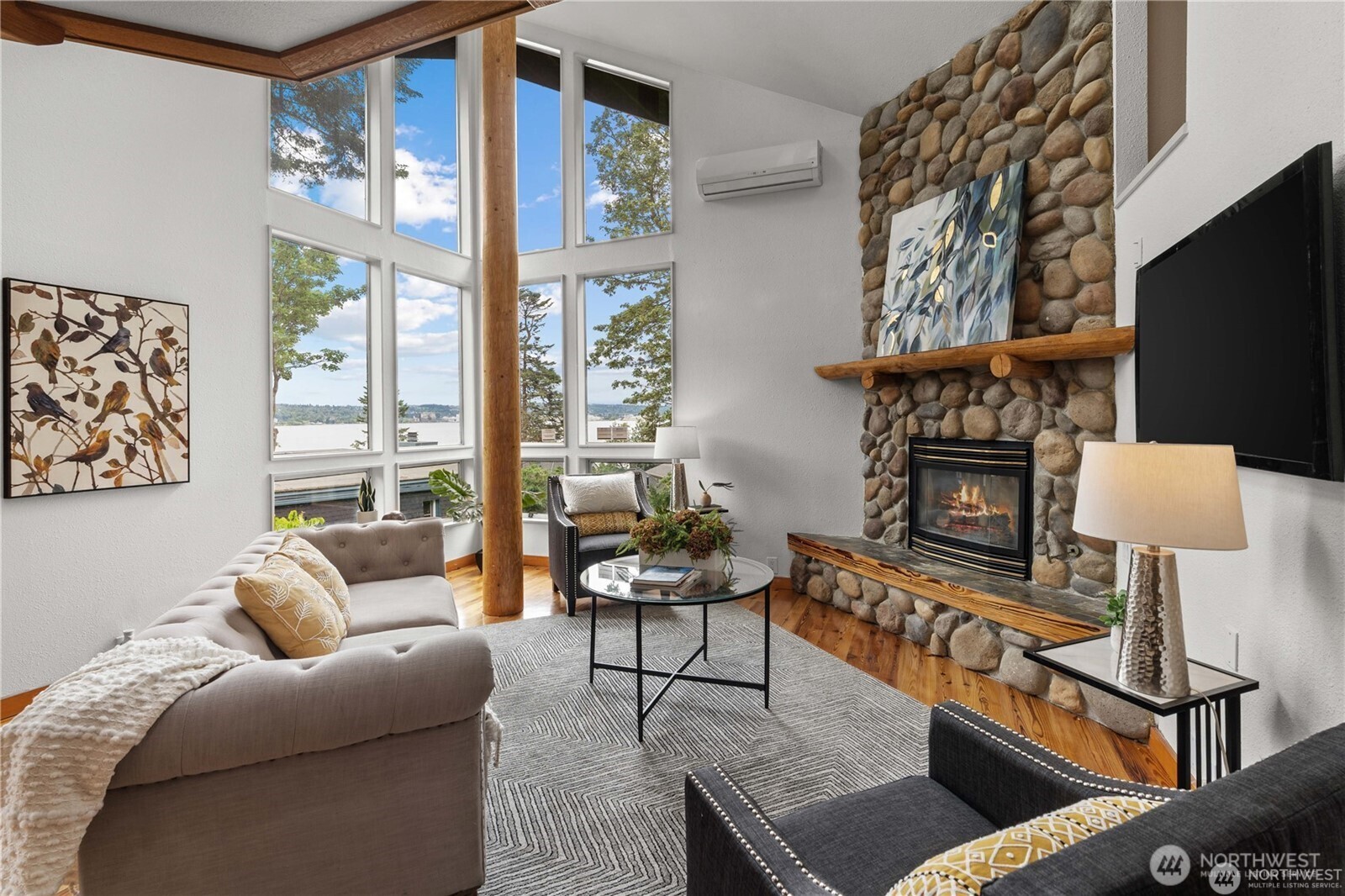 8526 East Mercer Way Mercer Island, WA 98040 - Photo 9 of 40 a living room with furniture a fireplace and a flat screen tv