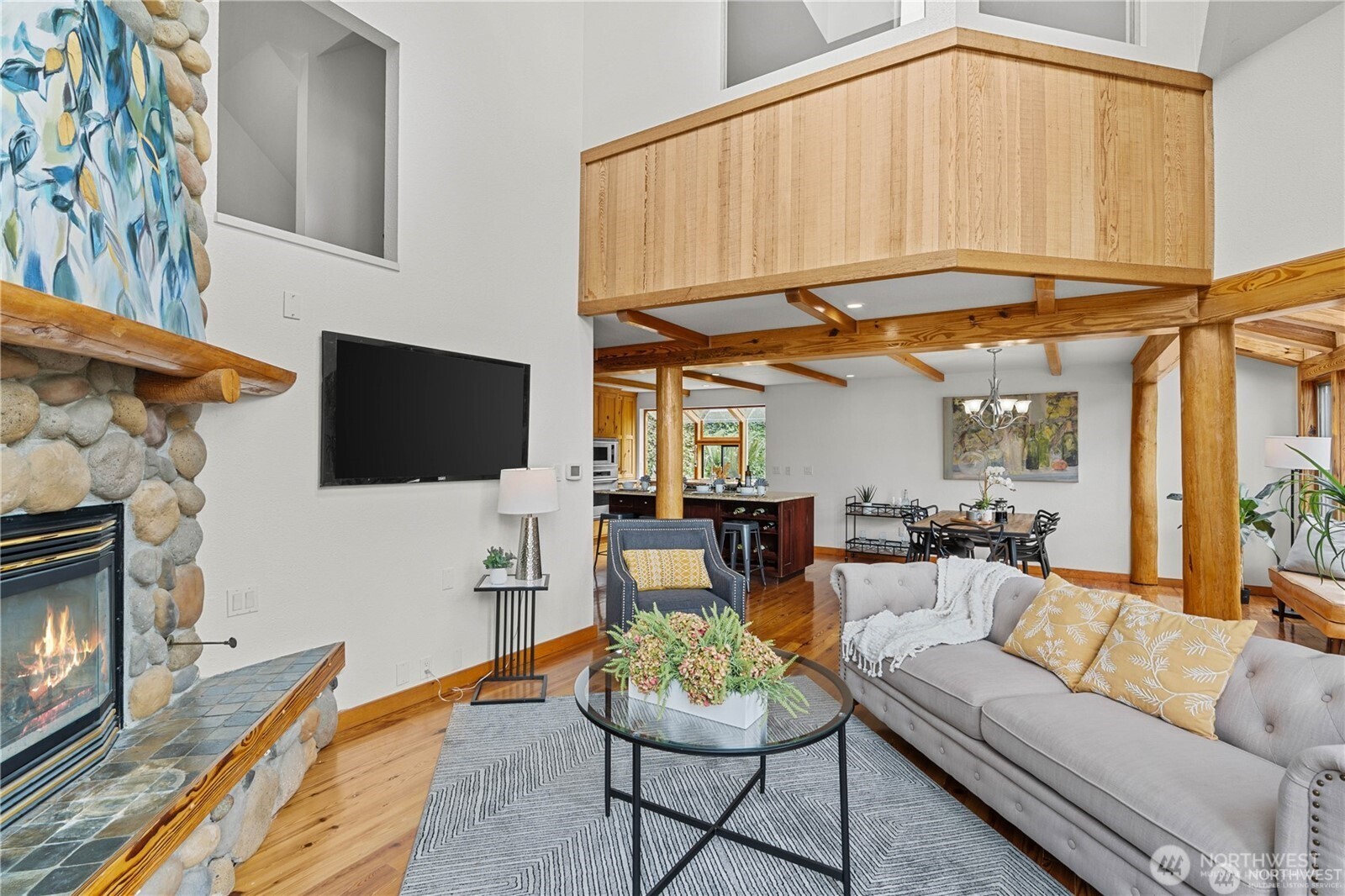 8526 East Mercer Way Mercer Island, WA 98040 - Photo 10 of 40 a living room with furniture a flat screen tv and kitchen view