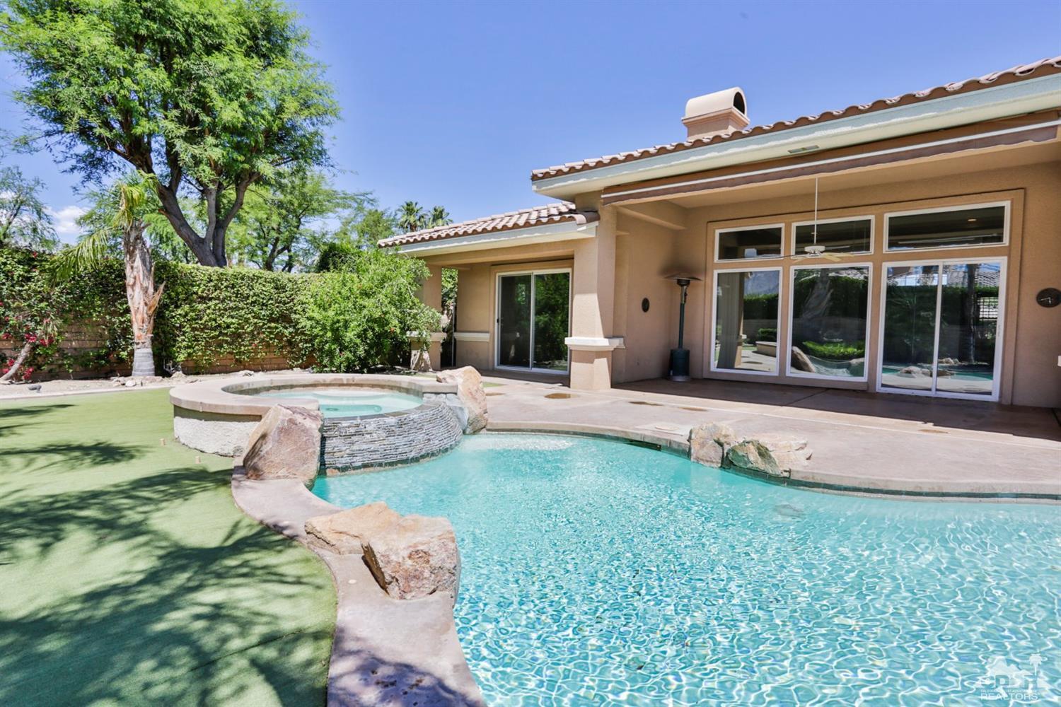 5 University Circle Rancho Mirage, CA 92270 - Photo 2 of 60 front view of a house with a yard