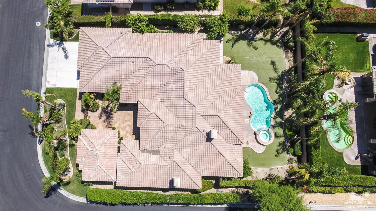 5 University Circle Rancho Mirage, CA 92270 - Photo 3 of 60 a aerial view of a house with a yard and large trees