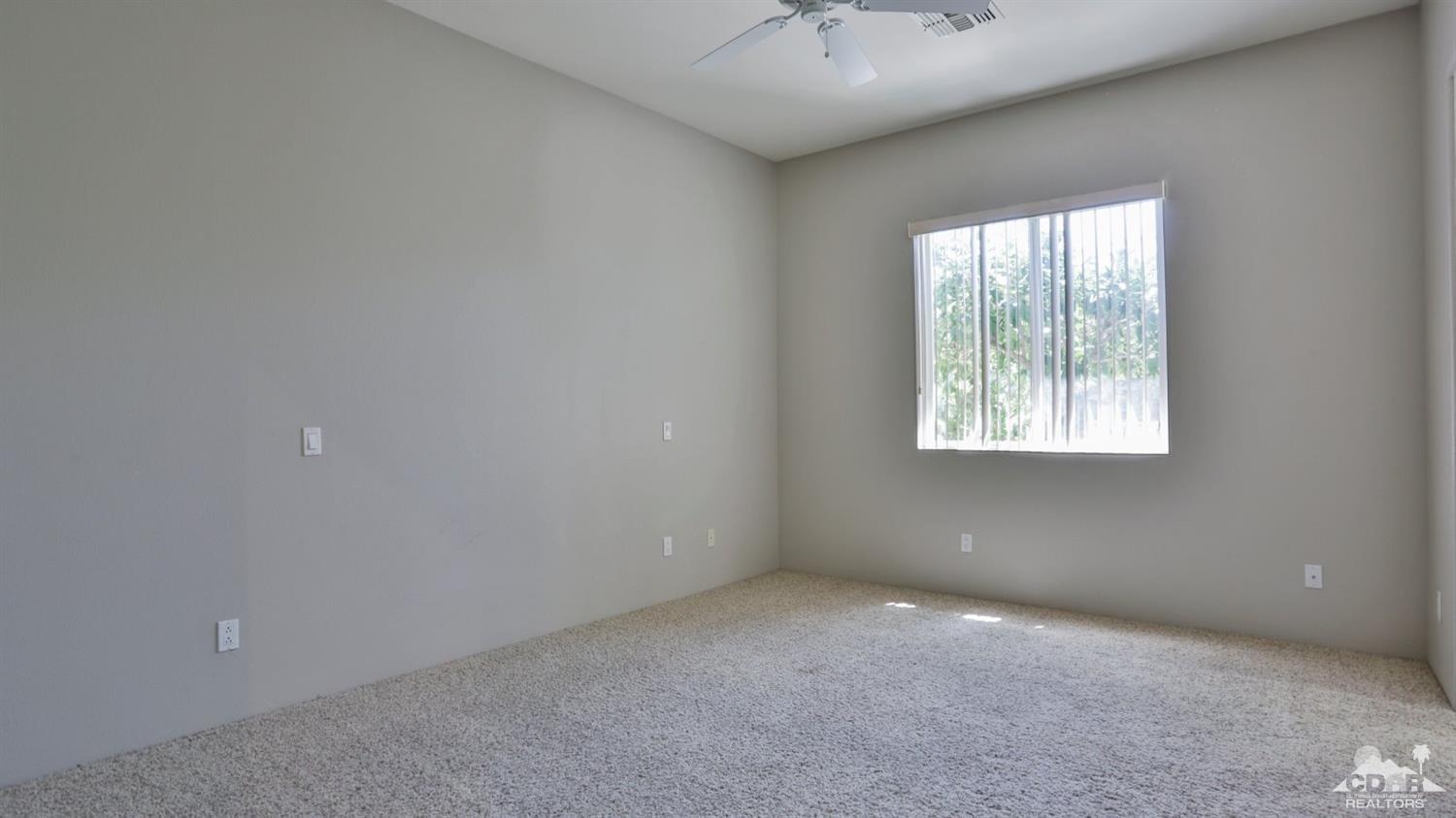5 University Circle Rancho Mirage, CA 92270 - Photo 35 of 60 an empty room with a window