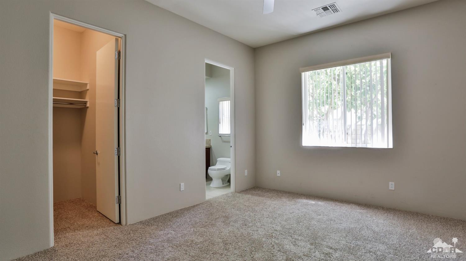 5 University Circle Rancho Mirage, CA 92270 - Photo 39 of 60 an empty room with windows and closet