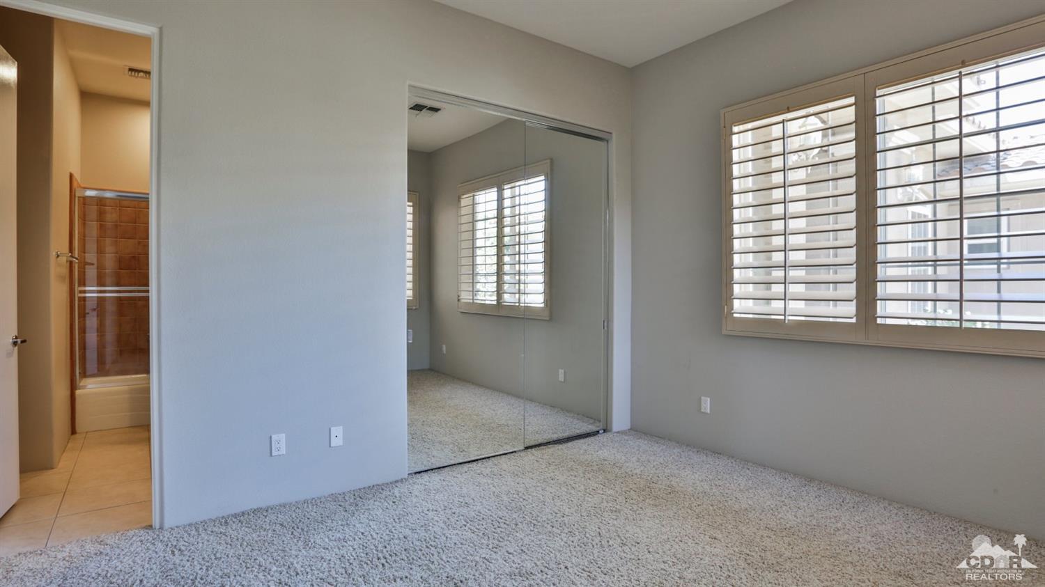 5 University Circle Rancho Mirage, CA 92270 - Photo 42 of 60 a view of an empty room with a window