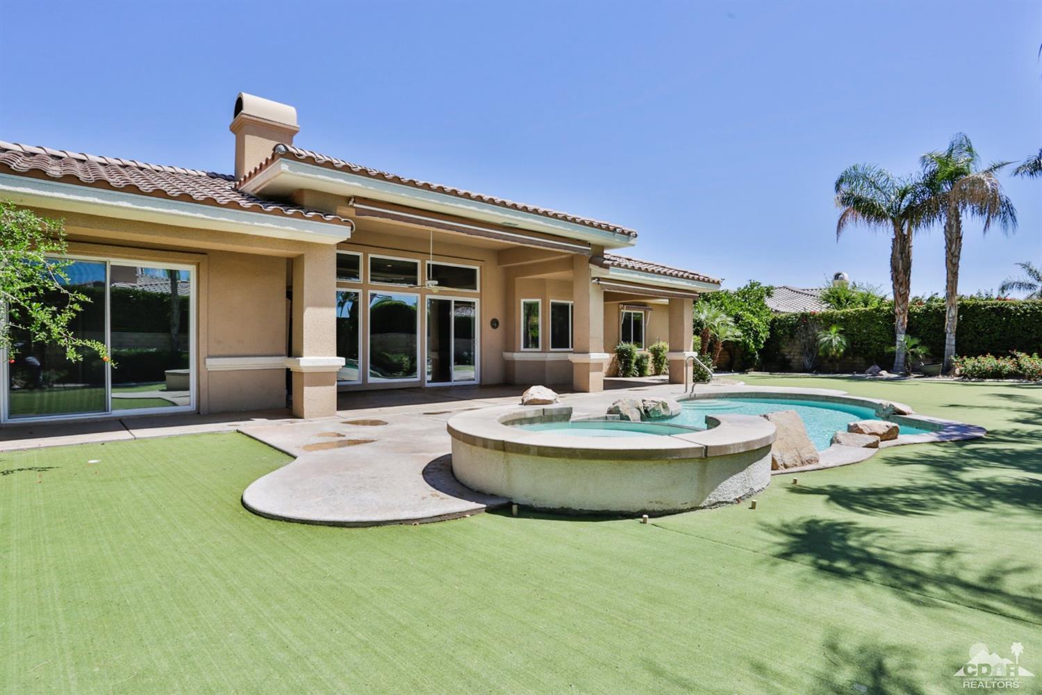 5 University Circle Rancho Mirage, CA 92270 - Photo 46 of 60 a view of a house with swimming pool and porch